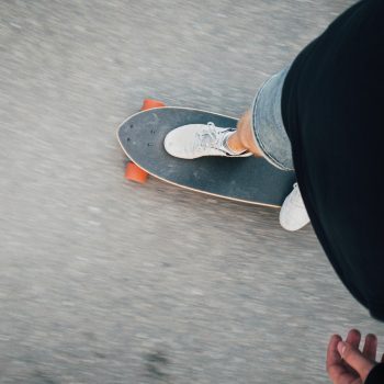 Web designer in Atlanta riding skateboard (a longboard)